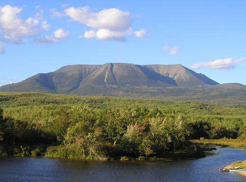 Mount Katahdin in northern Maine towers above its surroundings as seen from Abol Bridge on Golden Road
