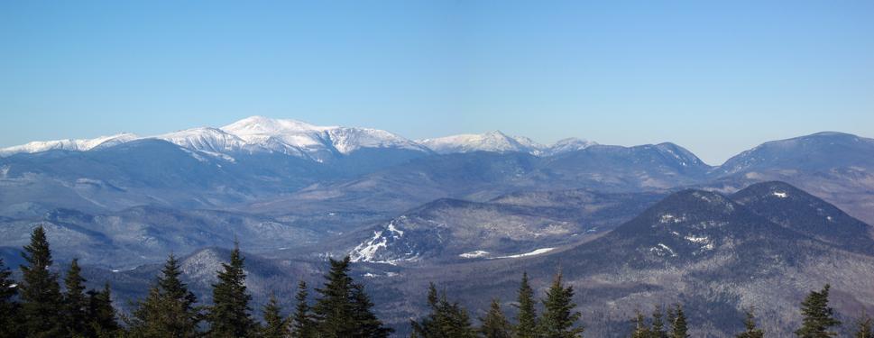 panoramic view of the White Mountains in December as seen from the summit of Kearsarge North in New Hampshire
