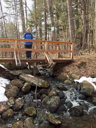 Andee poses on a footbridge at Keyes Farm in Pepperell, MA