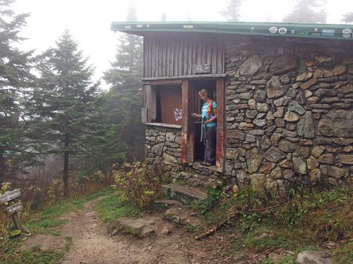 hiker at Cooper Lodge on the shoulder of Killington Peak in Vermont