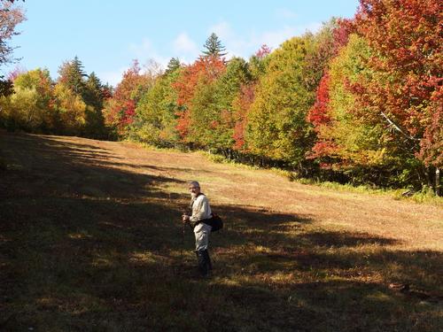 Dick hikes up a ski trail toward King Hill in southern New Hampshire