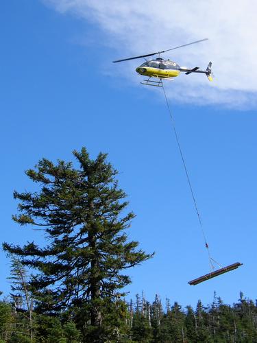 airlifting logs into Kinsman Pond Shelter in New Hampshire
