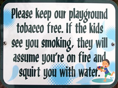 cute no-smoking sign at the playground entrance in Fort Foster Park at Kittery Point in southern Maine