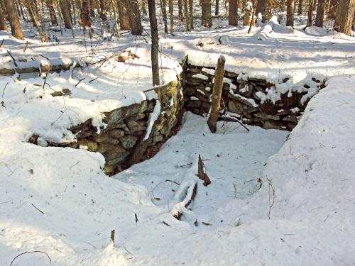 cellar hole in December at Kuncanowet Town Forest near Dunbarton, New Hampshire