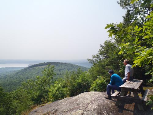 hikers at the summit of Ladd Mountain in New Hampshire