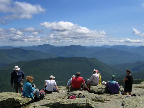 hikers enjoying lunch on the summit of Mount Lafayette in New Hampshire