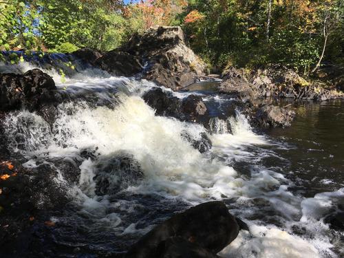 Wadleigh Falls in October on the Lamprey River Tour in southeastern New Hampshire