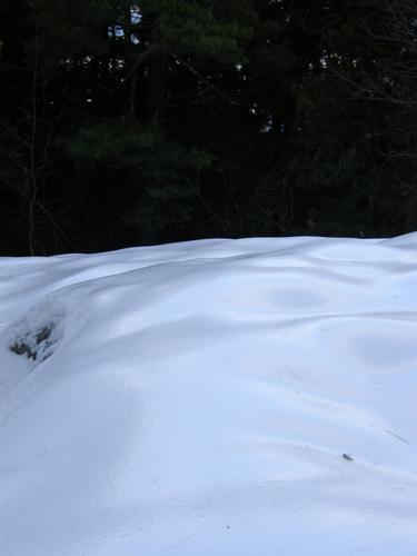 shiny snow crust on Little Larcom Mountain in New Hampshire