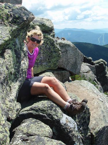 hiker atop Mount Liberty in New Hampshire