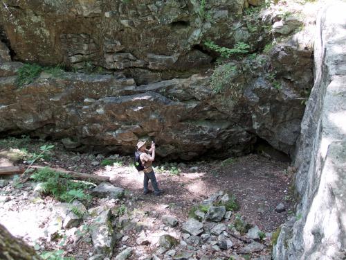 Andee checks things out inside a big rock hole at Lime Kiln Quarry near Chelmsford in northeast MA