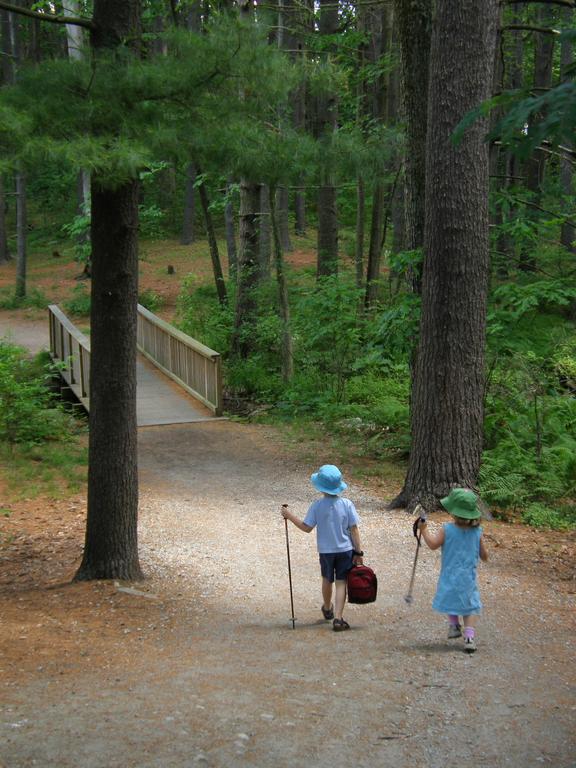 young hikers head out on the trail around Dorrs Pond in New Hampshire