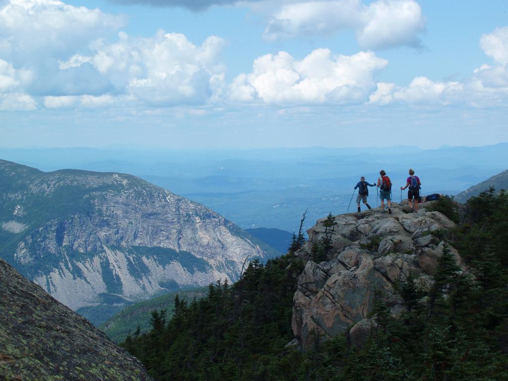 hikers head down trail off Mount Liberty toward Franconia Notch in New Hampshire