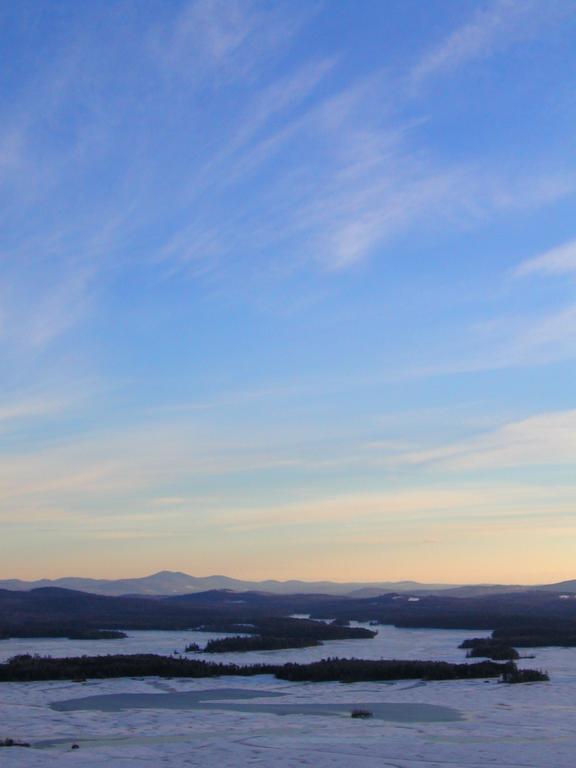 sunset view over Squam Lake as seen from West Rattlesnake Mountain in New Hampshire