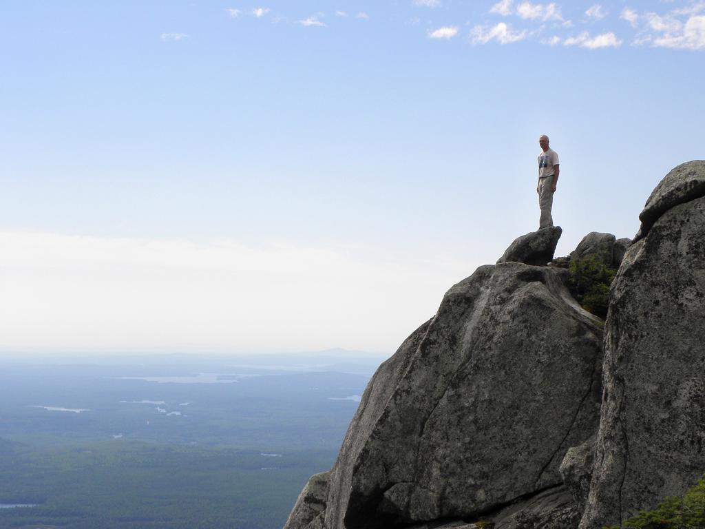 hiker on the South Peak of Doubletop Mountain at Baxter State Park in Maine