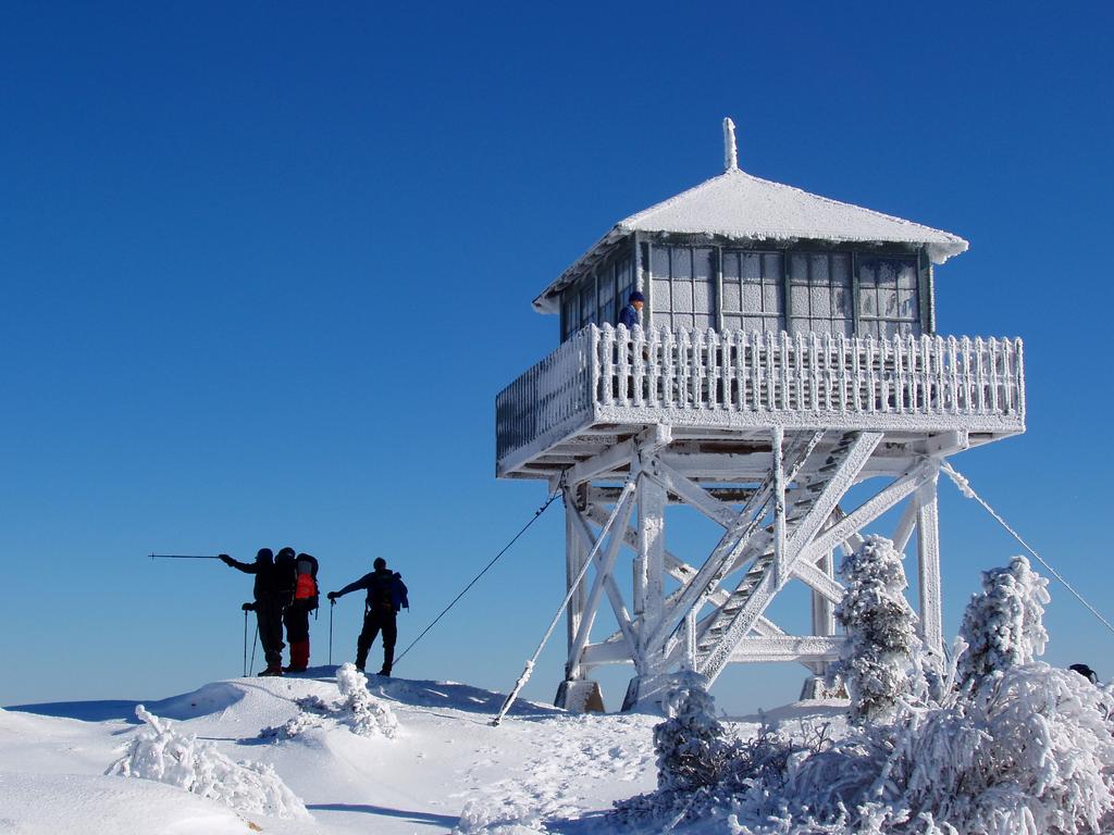 winter hikers at the observation tower on Kearsarge North Mountain in New Hampshire