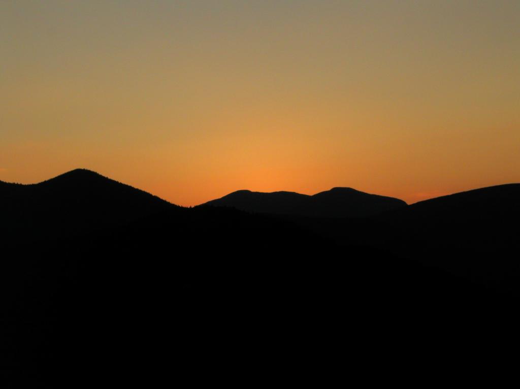 abstract sunset silhouette as seen from Potash Mountain in New Hampshire