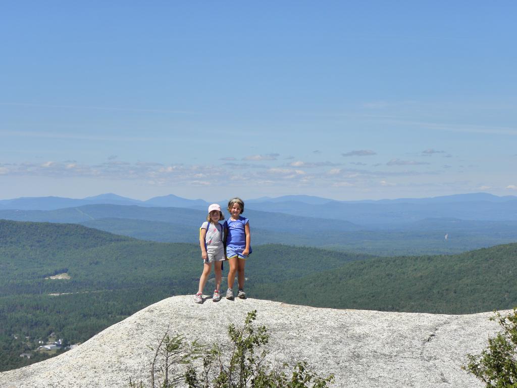 two young hikers atop Middle Sugarloaf Mountain in New Hampshire