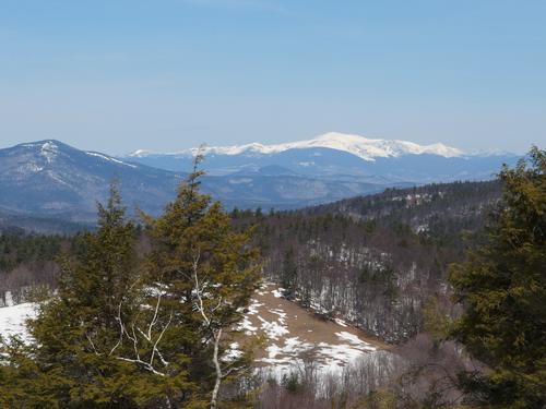 view in April of the snow-covered Presidentials as seen from Lyman Mountain in New Hampshire