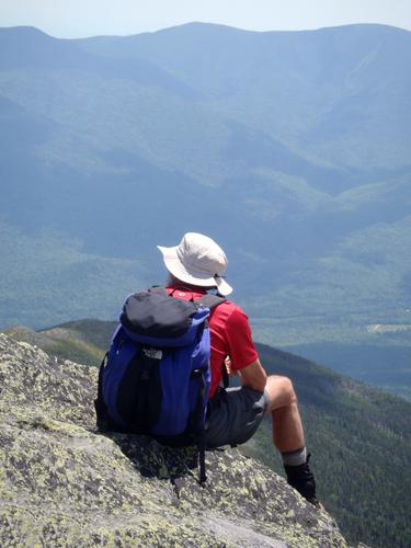 hiker atop Mount Madison in New Hampshire