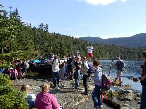 a crowd of hikers at Sterling Pond on the way to Madonna Peak in Vermont