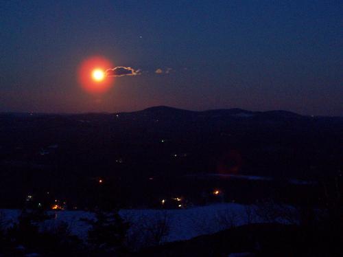 moonrise over lake Winnipesaukee as seen from Mount Major in New Hampshire