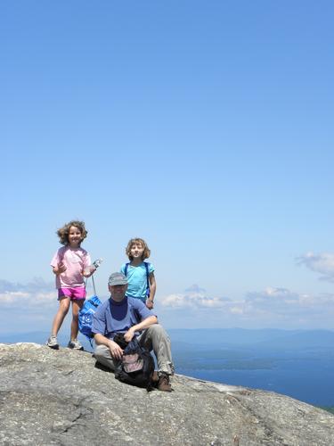 hikers on the summit of Mount Major in New Hampshire
