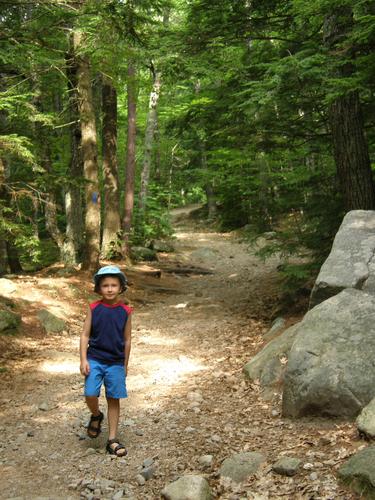 hiker on the trail to Mount Major in New Hampshire