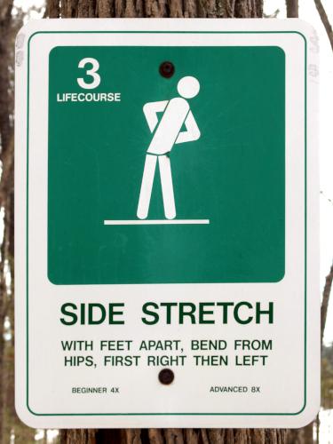 sign for an exercise station alongside the trail to Marble Hill near Stow in northeastern Massachusetts