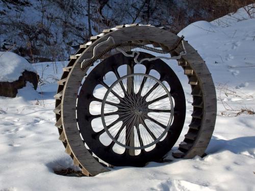 wheel modern-art sculpture in January at Mascoma River Greenway at Lebanon in western New Hampshire