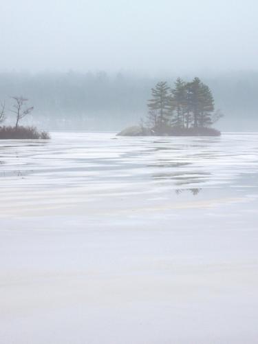 December fog-and-ice view from Battery Point of Lake Massabesic in New Hampshire