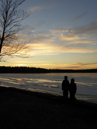 hikers at Battery Point for sunset at the Massabesic Audubon Center in New Hampshire