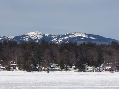 view in March of Mount Cardigan and Firescrew Mountain from frozen Newfound Lake near Mayhew Island in New Hampshire