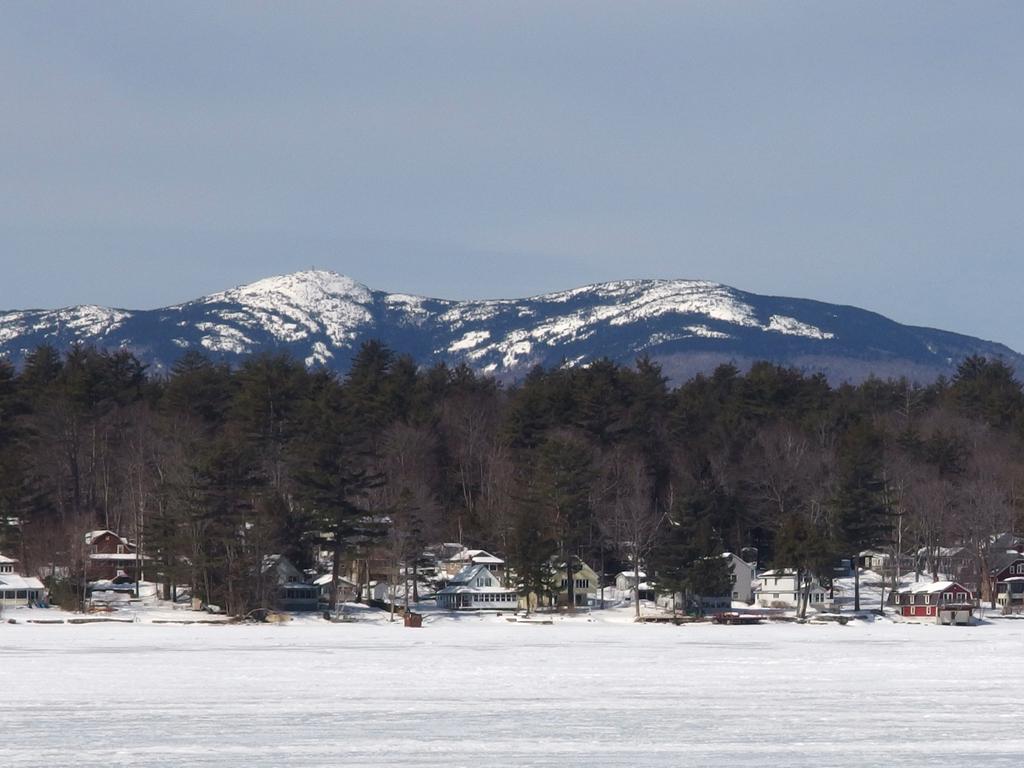 view in March of Mount Cardigan and Firescrew Mountain from frozen Newfound Lake near Mayhew Island in New Hampshire