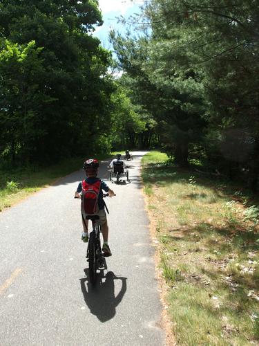 our group of bikers heads down the paved pathway on the Minuteman Bikeway between Bedford and Lexington in Massachusetts