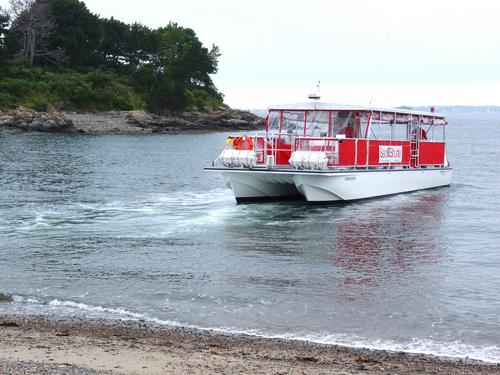 Sea Shuttle boat Endeavour backing off from Sandy Beach at Misery Island near Marblehead in Massachusetts