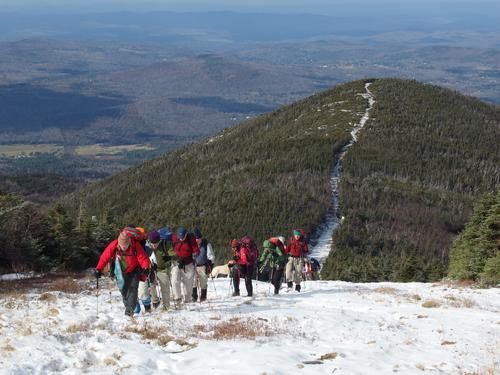 hikers on the way up from Mittersill Mountain to Cannon Mountain in New Hampshire