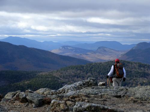 hiker on the trail to Moat Mountain in New Hampshire