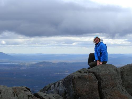 hiker on the summit of South Moat Mountain in New Hampshire