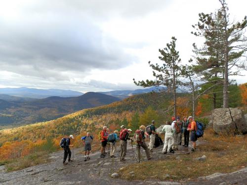 hikers on the trail to Moat Mountain in New Hampshire