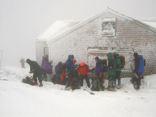 winter hikers gearing up for the ascent to Mount Monroe in New Hampshire