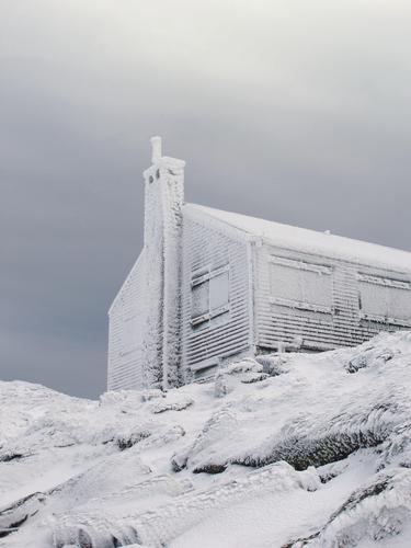 Lakes of the Clouds hut encrusted in rime ice in New Hampshire