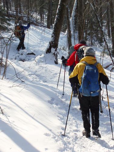 winter hikers on the trail to Mount Moosilauke in New Hampshire