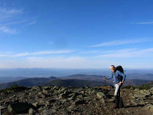 hiker on the South Peak of Mount Moosilauke in New Hampshire