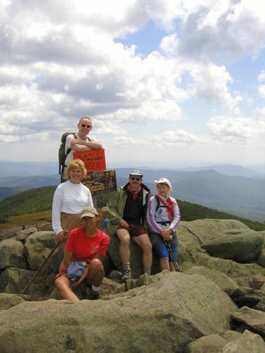hikers on the summit of Mount Moosilauke in New Hampshire