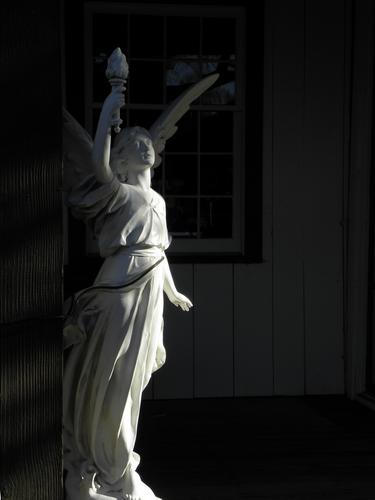 angel statue outside a shop at Olde Mistick Village in Connecticut