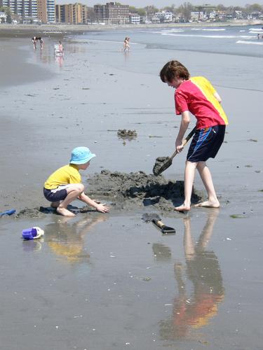 kids constructing in the sand at Nahant Beach in Massachusetts