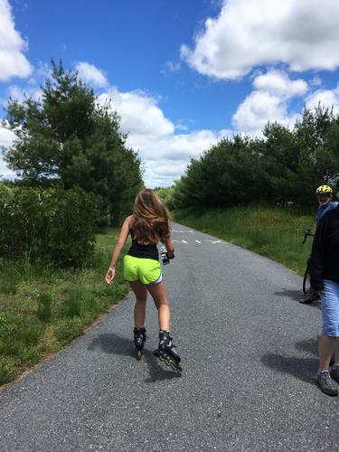 roller blader on the Nashua River Rail Trail North in southern New Hampshire