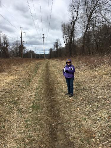 Andee poses on the dirt road beside Nashua Railroad North in southern New Hampshire