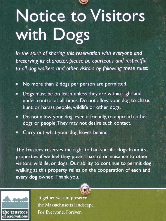 Dog Courtesy sign posted by the Trustees of Reservations at Noon Hill in eastern Massachusetts