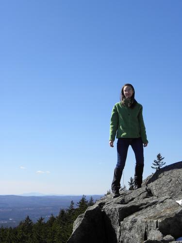 hiker at the south viewpoint on North Pack Monadnock Mountain in New Hampshire